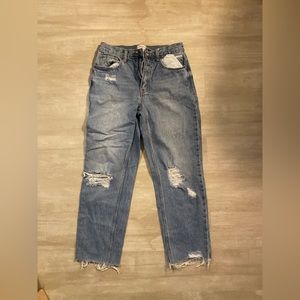 Straight leg, slightly distressed medium/light wash jeans